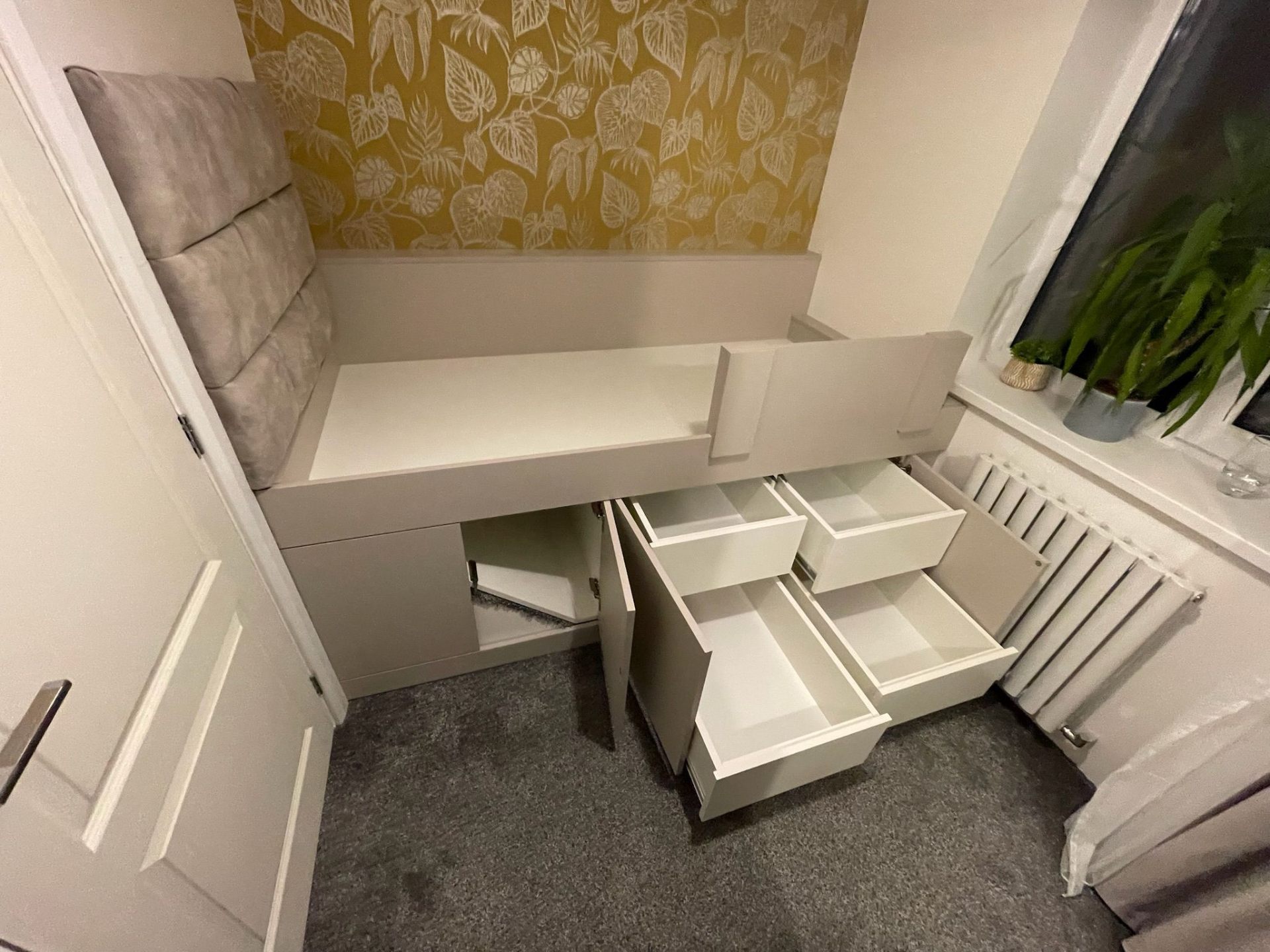 Hallway storage bench with cushion top and shoe storage below