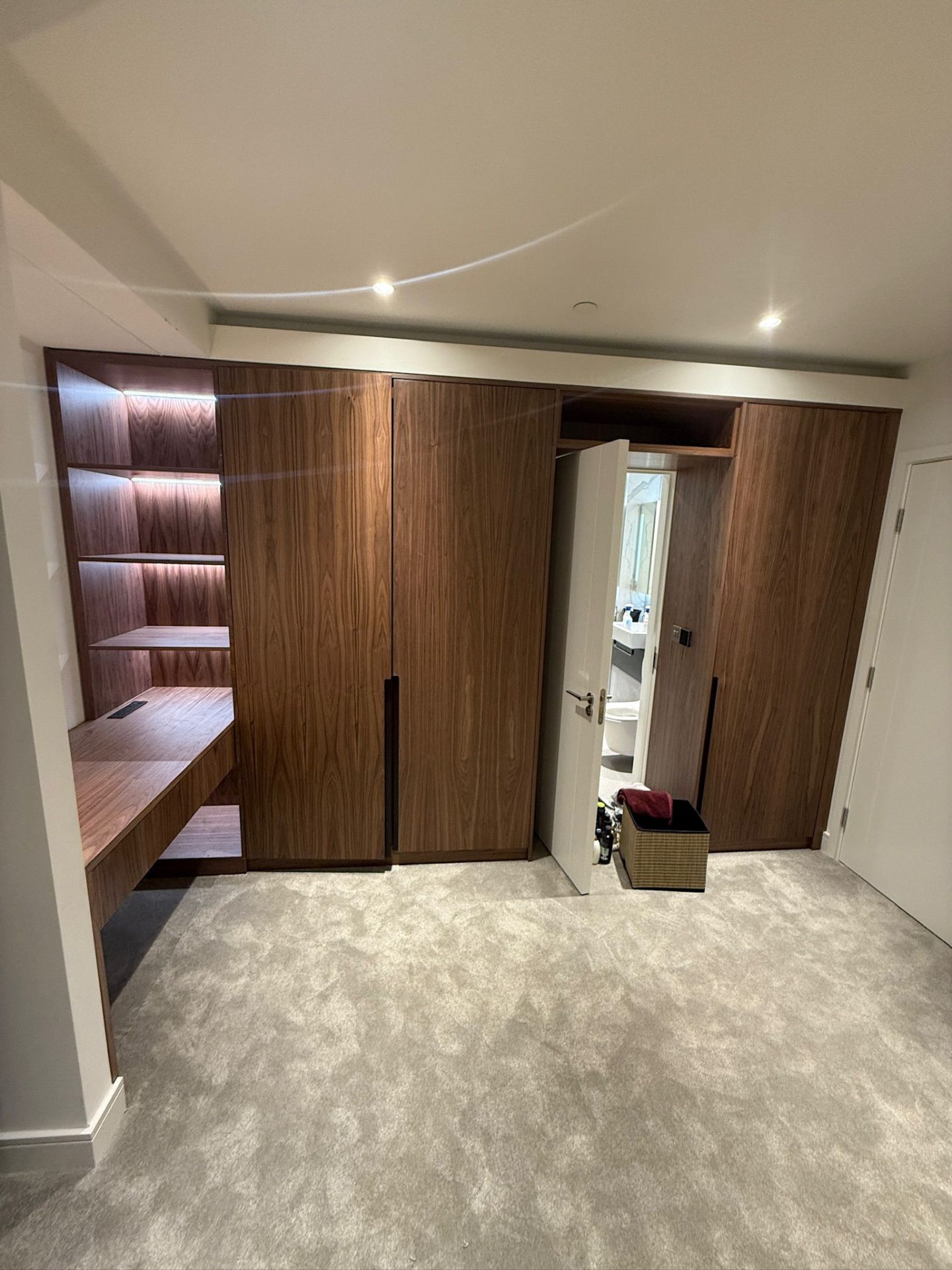 Bespoke walnut wardrobe with LED lighting — handcrafted by Bear Brothers Furniture in Epping